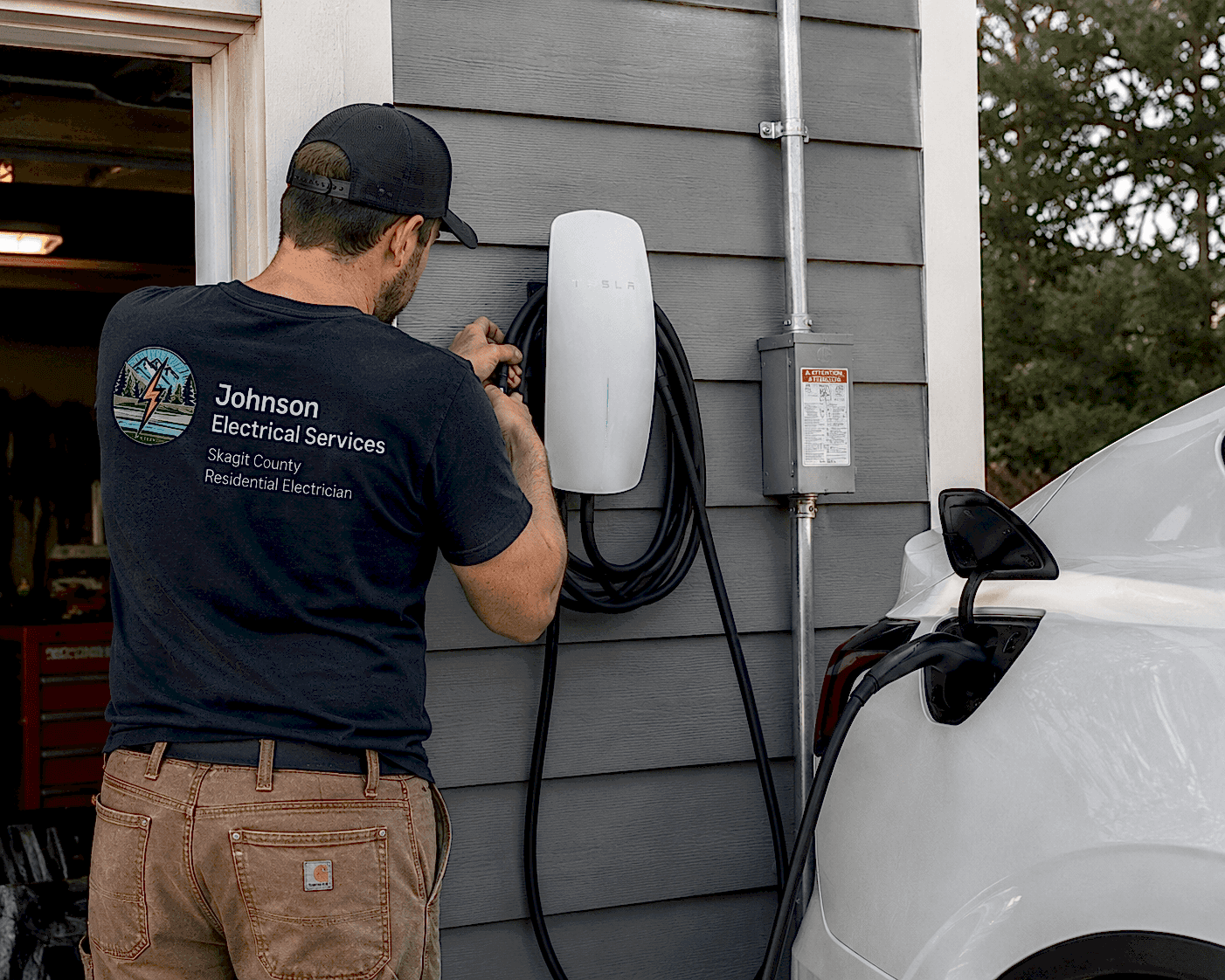 ev-charger-installation-skagit-valley-johnson-electrical-services Electrician installing a Level 2 EV charger at a residential home in Skagit Valley, WA by Johnson Electrical Services.
